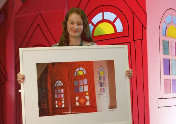 Ellisha Richardson with her winning art work Windows of Lancaster.