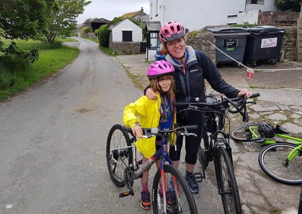 Anna Hopkins with daughter Eva during their bike ride.