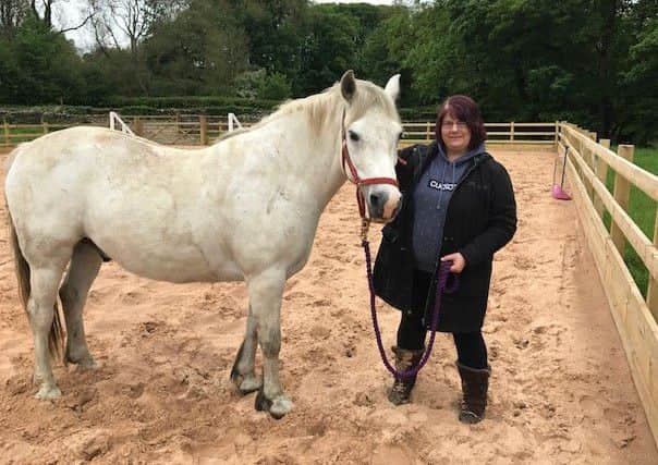 Michelle Blade with Eddie the horse after her mediation session. Picture: Katherine Beaumont.