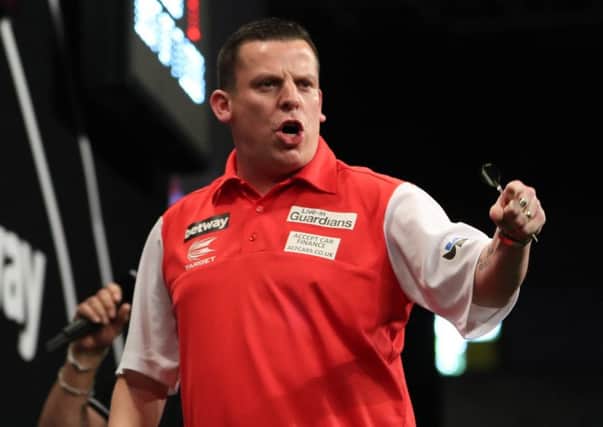 Dave Chisnall in action during Englands first round win over Gibraltar. Picture: Lawrence Lustig