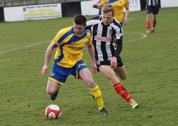 Charlie Bailey, right, in action for Kendal Town against Lancaster City. Picture: Richard Edmondson
