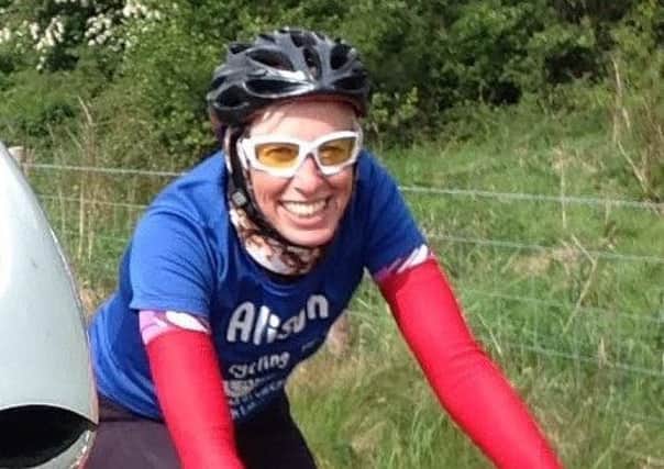 Alison Stainthorpe, head of operations at CancerCare, doing a charity bike ride.