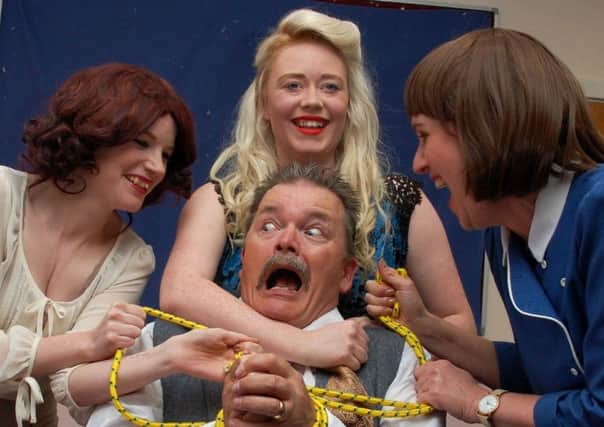 Franklin Hart Junior (played by Ray Jenkinson) is tied up and held captive by (left to right)  Judy (Hannah Morris),  Doralee (Sophie Butler), Violet (Alison Birtle) as part of the 9 to 5 musical by Morecambe Amateur Operatic and Dramatic Society (MAODS). Picture by John Atkinson.
