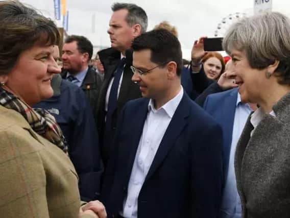 Theresa May, Secretary of State James Brokenshire, and Arlene Foster at the Balmoral Show last month