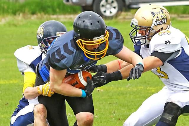 Aidan Banks under pressure from the Leeds Bobcats defence. Picture: Tony North