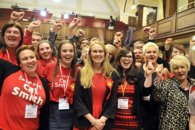 Cat Smith (centre) and her supporters celebrate her win at Lancaster Town Hall.