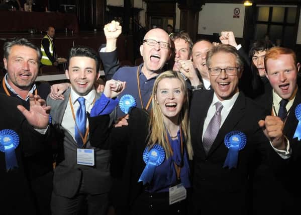 David Morris (second right) and his supporters celebrate at Lancaster Town Hall