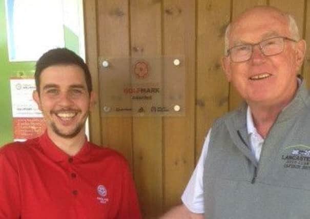 Lancaster Golf Club receives their award for GolfMark (left to right) Adam McAlister (Lancashire Golf Development Group Club Support Officer) and
Tony McMunn (Captain, Lancaster Golf Club).