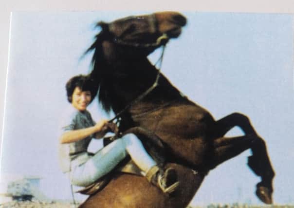 Lynda Wiggins on one of her horses.