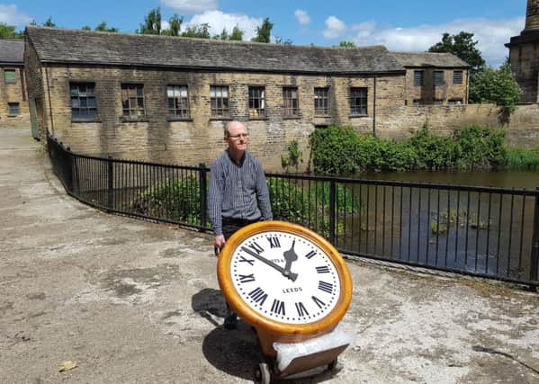 John McGoldrick, Leeds Museums and Galleries' curator of industrial history, moving the Potts clock that has just arrived at Leeds Industrial Museum.