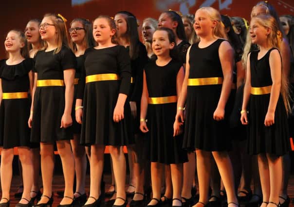 Lancaster children joined others to form The Lake Choir performing at Her Majestys Theatre. Cap