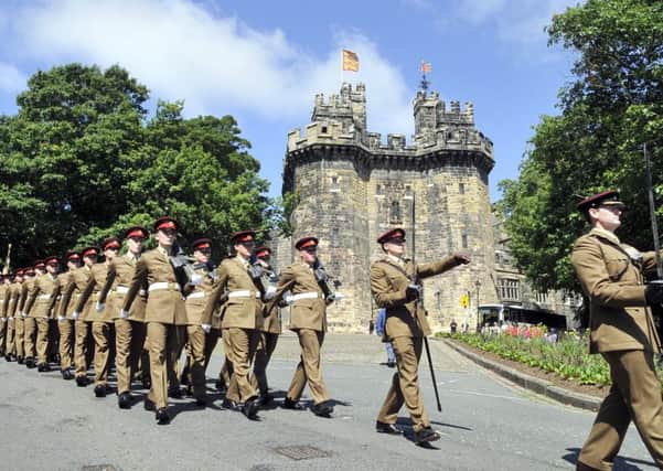 The Duke of Lancaster's Regiment march past Lancaster Castle