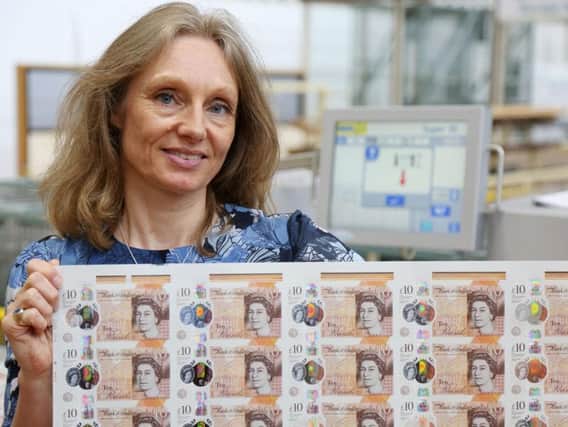 Chief Cashier Victoria Cleland with the new 10 note featuring Jane Austen.