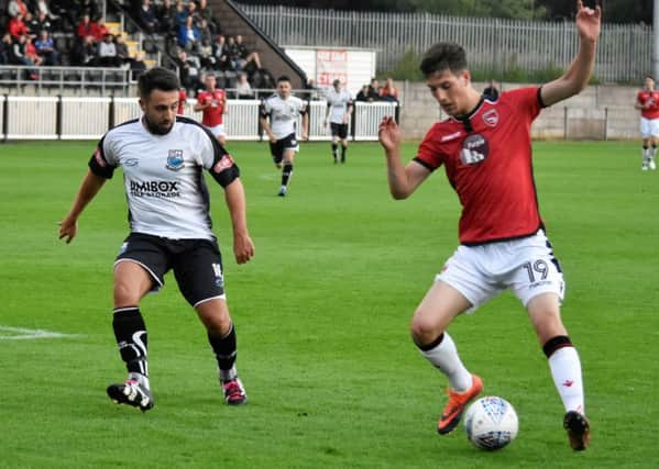Reece Deakin in action during Morecambes friendly against Bamber Bridge.