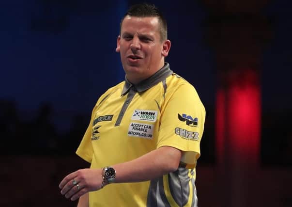 Dave Chisnall rues a missed chance. Picture: Lawrence Lustig