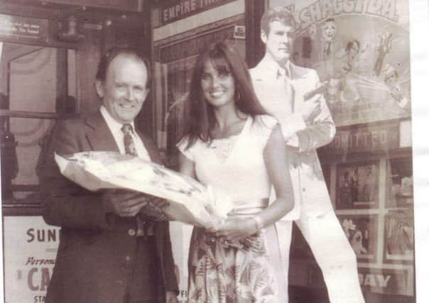Douglas 'Mac' MacGregor with Bond girl Caroline Munro outside the Empire Cinema during a run of The Spy Who Loved Me in 1977.