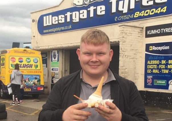 Customer Dave Penny with a Mister Softee UK ice cream outside Westgate Tyres.