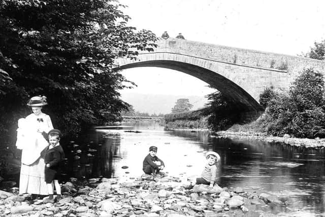The seventh bridge to be destroyed by the flood was Mealbank Bridge on Wennington Road, Wray. This photograph shows this most beautiful bridge on a summers day in 1912.