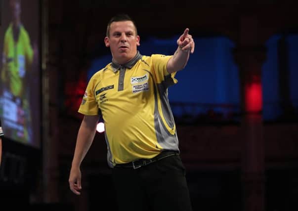 Dave Chisnall won the Players Championship 18 final in Barnsley on Sunday. Picture: Lawrence Lustig.