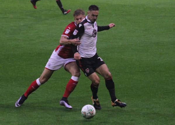 Shrimps captain Michael Rose in action at Barnsley.