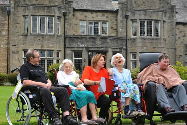 Julie Evans (centre) with residents from left, Geoff, Doris, Kathryn and Jenny at St Wilfrids Hall Nursing Home. Picture by Neil Cross.