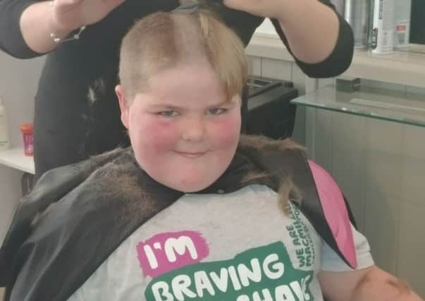 Mason Walker, 10, from Morecambe, who 'braved the shave' to raise money for Macmillan Cancer.
