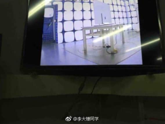 Blurry pictures appear to show an Apple branded television screen in a test lab