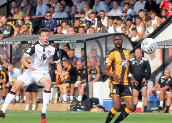 Andy Fleming goes for goal at Cambridge.