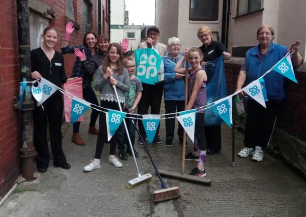 Manager of the Co-op on Regent Road Lily Grantham has organised a 'West End spruce up event' for employees, customers and members of the public. Pictured from left are Lily Grantham, Yvonne Brade, customer sales assistant with her children Ruby, Ella and Lewis Roberts, Linda Westrop, supervisor, Roger Lund, customer, Rita Stobbs, customer, Julie Munro, customer sales assistant and Dorothea Turkington, customer.