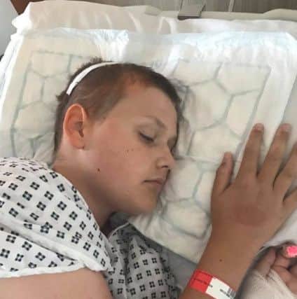 Reece Holt, from Overton, shortly after his third brain surgery at Alder Hey Children's Hospital in Liverpool.