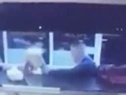 A screen grab of video footage showing a man and a woman seconds before he elbowed her in the face.