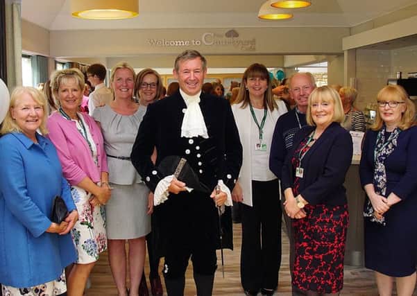 Robert Webb JP DL, High Sheriff of Lancashire, centre, Sue McGraw to the right of Robert and Catherine Butterworth, head of fundraising, to the left, with volunteers at The Courtyard Cafe opening inside St John's Hospice, Lancaster. Picture by Andy Cruxton.