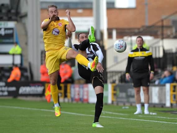 Adam McGurk battles with Nicky Hunt at Meadow Lane. Picture: B&O PRESS PHOTO