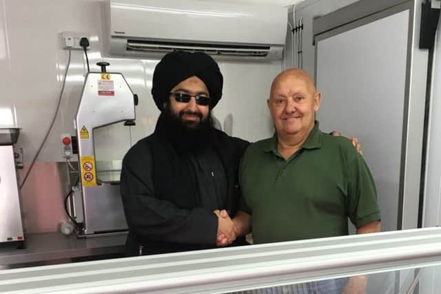 Peter Bartley with new butcher Maulana Abbas.