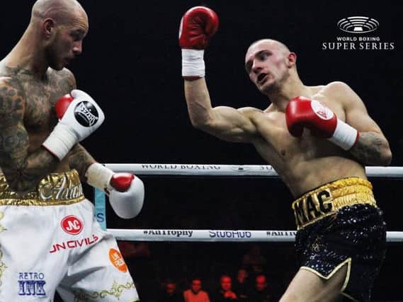 Reece MacMillan, right, goes on the attack against Adam Little. Picture: World Boxing Super Series