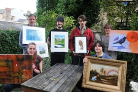 Photo Neil Cross Faye Penny, Tom Williamson, Ben Hall, Charlie Kondras, James Attwood and Zannie Drayman helping to put together the "Anti-fracking art auction" at the cafe. Please get a pic with artists and staff at The Whale Tail
