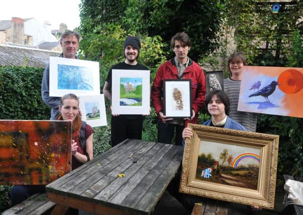Photo Neil Cross Faye Penny, Tom Williamson, Ben Hall, Charlie Kondras, James Attwood and Zannie Drayman helping to put together the "Anti-fracking art auction" at the cafe. Please get a pic with artists and staff at The Whale Tail
