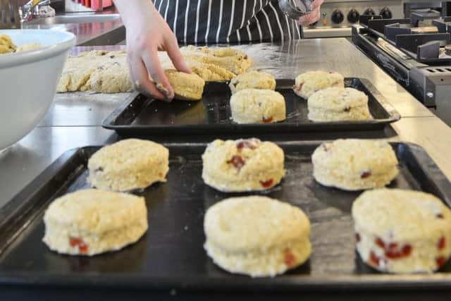 College students are hosting an afternoon tea.