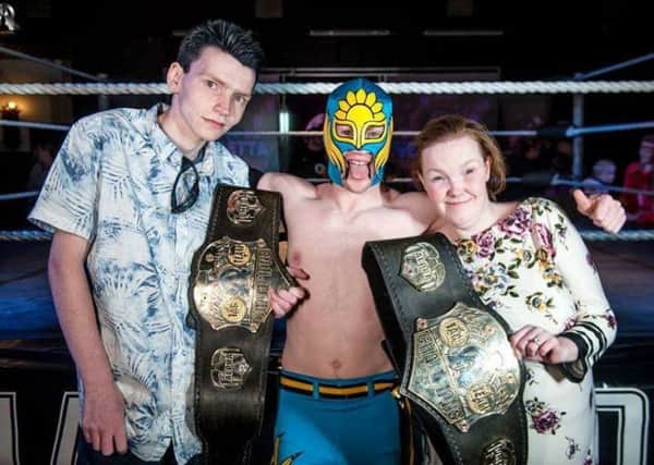 The late Martin Rogers pictured at an Alpha Omega Wrestling event in Morecambe with wrestler Solar and fellow wrestling fan Sarah McDermott. Photo by Tony Knox.