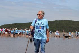 Cedric Robinson leads a previous Galloway's walk across the bay.