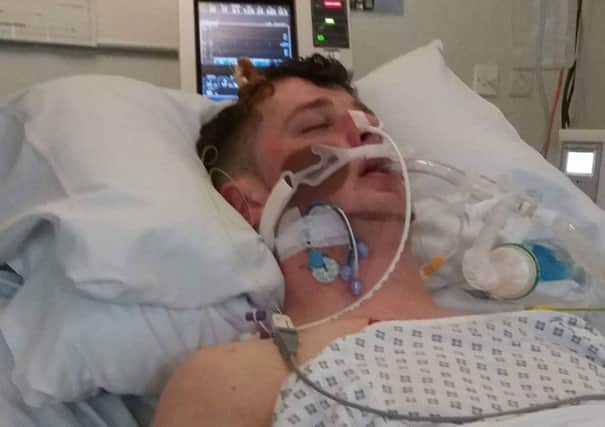 Chris Griffin in hospital after the attack.