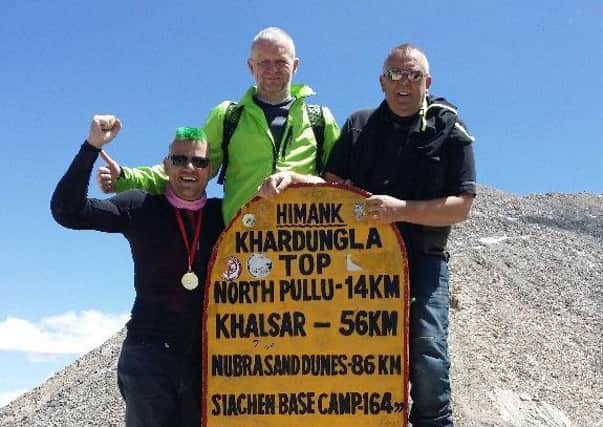 (Left to right) Nigel Ralphson, Brian Mills-Woods and Robert Hodgson at the top of the Khardung La Pass.