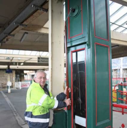 Peter Yates winding Carnforth Station Clock. Photo by Robert Swain.