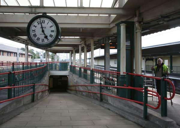 Peter Yates with Carnforth Station Clock. Photo by Robert Swain.