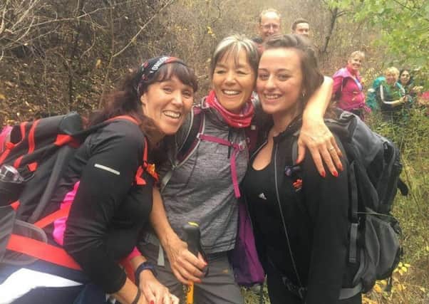 From left: Linda Eccles and Dianne Farrell  who were doing a trek on the Great Wall of China when they bumped into  Georgia Payne from Morecambe, who is studying in China for a year.