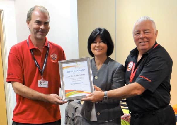 Director of Governors Mary Aubrey presenting North West Blood Bikers with their Star of the Quarter award.