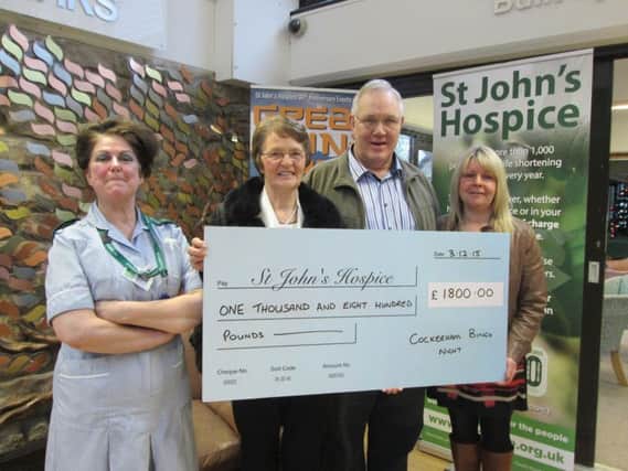 Organisers of the Cockerham charity bingo night make a presentation to St John's Hospice