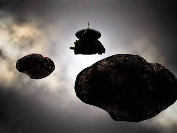 Artist's concept of NASAs New Horizons spacecraft flying by 2014 MU69