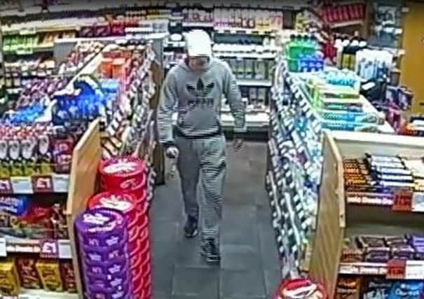 Police want to speak to this man in connection with a knifepoint robbery in Morecambe.