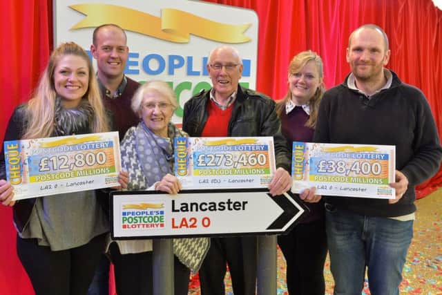 Pictured at Glasson Dock are the Peoples Postcode Lottery winners from postcode LA2 0 receiving their winner's cheques. Left to right is Steph and Lee Hoggarth, Enid and Charles Bostock, Susan and Brayfield. Pictures Copyright Darren Casey / DCimaging 07989 984643